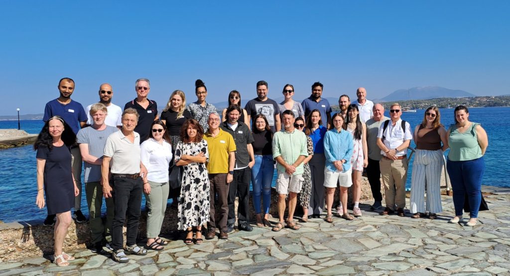 Photo of a large group standing on a peer.