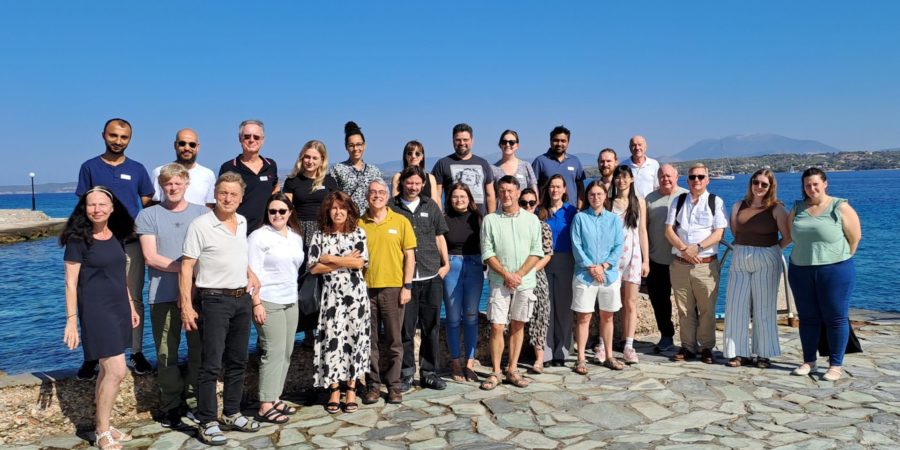 Photo of a large group standing on a peer.